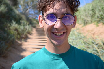 Attractive guy on vacation takes a selfie.