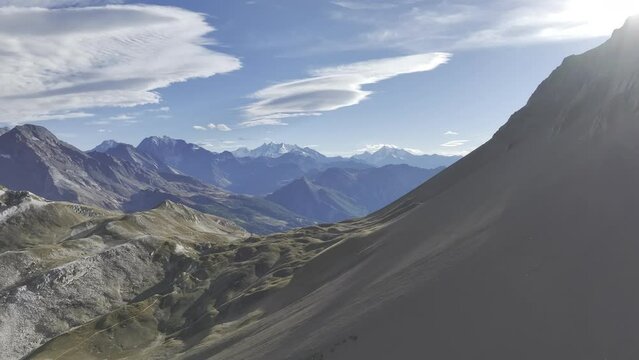 Erosion forms on the Risand and weather phenomenon Foehn lenses with a view of the Simplon region, Saflischpass, Valais, Switzerland, Europe