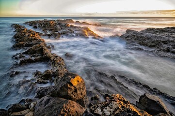 Scenic shot of a rocky beach at Snapper Rocks in Gold Coast, Queensland, Australia during sunrise