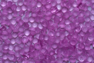 Pink of plastic polymer granules for background.