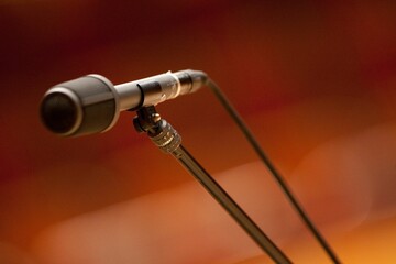 Closeup shot of microphone on stand against blur background