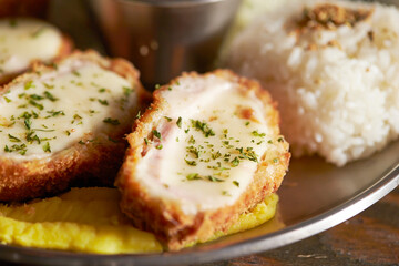 Cheese pork cutlet on a plate