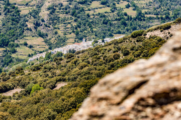 Elevated high mountain view of Capileira, Andalusia, Spain. Spring outdoors hiking view.