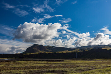 Fototapeta premium Summer travel landscape with clouds over mountains, Iceland