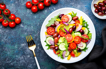 Tasty salad with kalamata olives, tomatoes, paprika, cucumber and onion, healthy mediterranean...