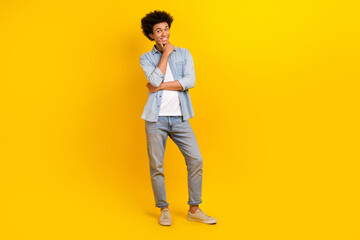 Fototapeta premium Full body portrait of cheerful person hand touch chin contemplate ponder isolated on yellow color background