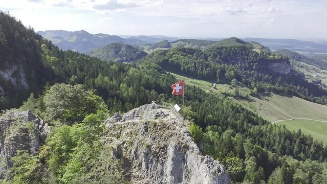 Flight over the Belchenflueh, Swiss flag flying on viewing platform, Jura summit with view of the Black Forest, Solothurn, Switzerland, Europe