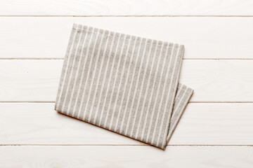 top view with gray kitchen napkin isolated on table background. Folded cloth for mockup with copy space, Flat lay. Minimal style