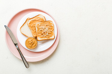 Peanut butter sandwiches or toasts on light table background.Breakfast. Vegetarian food. American cuisine top view vith copy space