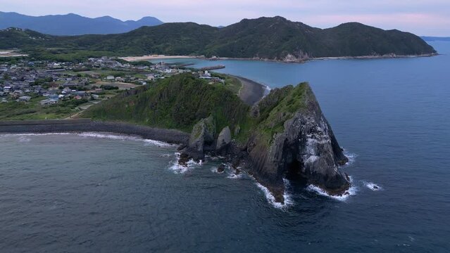 Itoshima, Japan: Aerial drone footage of the dramatic Keya no Ohto cliff and coastline in the Kyushu island near Fukuoka in Japan at dusk. Shot with an orbit motion