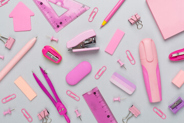 Pink school stationery on color backgroung, top view