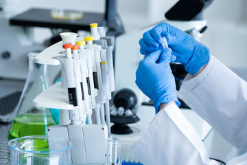 Close-up of a scientist's hand doing research with a centrifuge and its tube in a laboratory