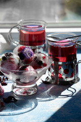Frozen berries, iced summer hibiscus tea
