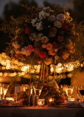 the decorated table has candles and flowers on it and lights in the background