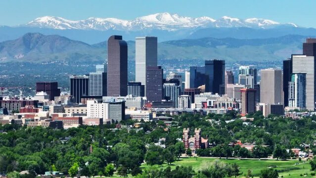 Downtown Denver aerial drone City Park cityscape Nuggets Avalanche Rockies Rocky Mountains snow Mount Evans best cinematic original parallax foothills Colorado spring summer green lush to right