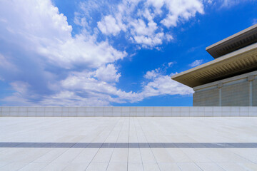 Blue sky, white clouds and a corner of modern architecture