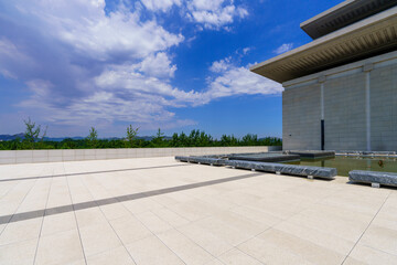 Blue sky, white clouds and a corner of modern architecture