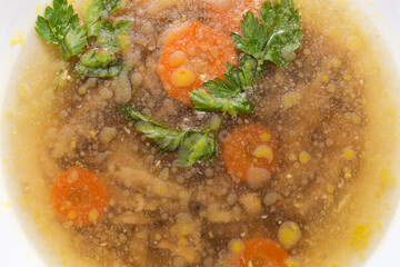 Chicken jelly in the white bowl, top view close-up