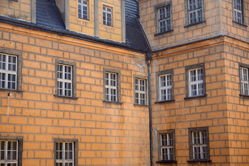 Fototapeta na wymiar External windows of the old castle. beautiful facade of the building.