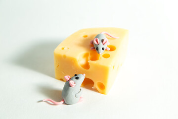 Little plasticine mice and a piece of cheese with holes.