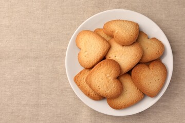 Heart shaped Danish butter cookies on table, top view. Space for text