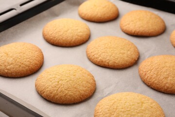 Delicious Danish butter cookies on baking tray, closeup