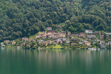 Fototapeta na wymiar Panoramic view of Carabietta, a fraction of the Swiss municipality of Collina d'Oro, in the Canton of Ticino (district of Lugano), Switzerland