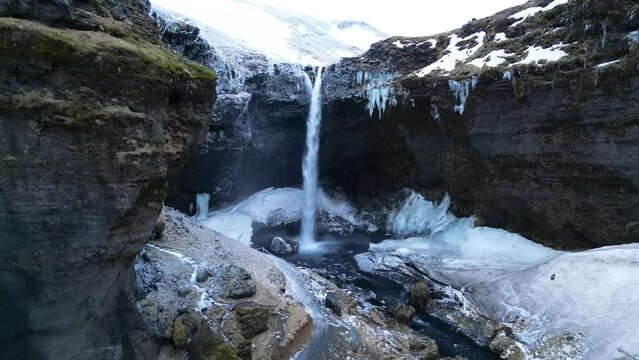 Scenic view of Kvernufoss frozen waterfall in the south coast of Iceland