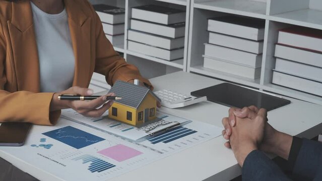 Lawsuits against Real estate agent and realtor general liability insurance businessman professional discussing and consultant with house toy model building before sign a contract with law concept
