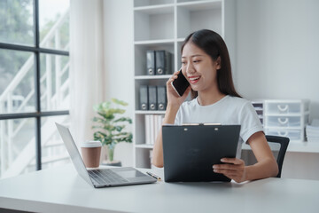 Young Asian woman university student satisfied with learning english language during online courses via laptop computer, learning online with webinar, video tutorial, internet lessons