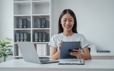 Young Asian woman university student satisfied with learning english language during online courses via laptop computer, learning online with webinar, video tutorial, internet lessons