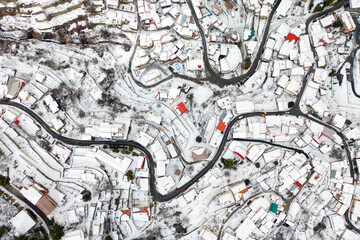 Aerial view of Kyperounta village with snow covered houses. Limassol District, Cyprus