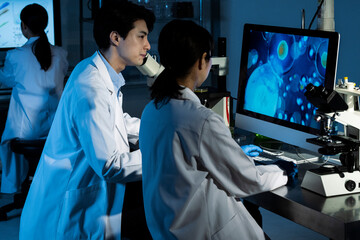 Scientists discussing progress in the laboratory	