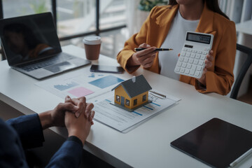 Lawsuits against Real estate agent and realtor general liability insurance businessman professional discussing and consultant with house toy model building before sign a contract with law concept