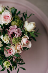 Bouquet of beautiful pink roses on the dressing stool 