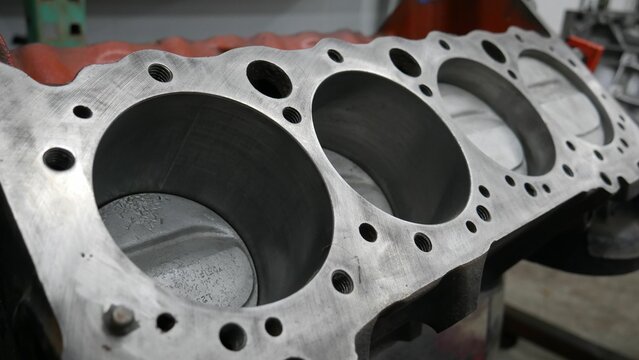 the head of an engine block is shown in a machine shop