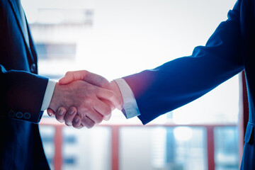 Negotiating business,Image of businessmen Handshaking,Handshake Gesturing People Connection Deal Concept © Smallroombigdream