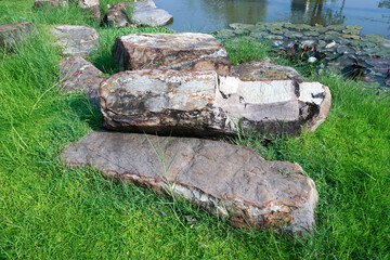 stones on a green lawn background