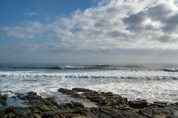 Beautiful view of a tranquil beach on a cloudy sky background