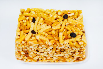 tatar chak chak in a pack on a white background. sweet flour sticks in honey on a light background. colorful flour treats for breakfast