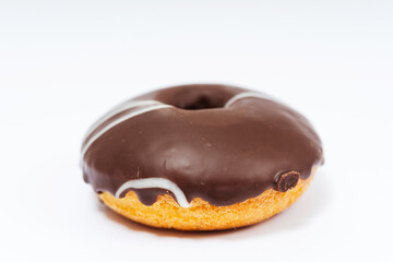 chocolate donuts on a white background. flour donuts with chocolate icing on a light background. colorful pastries