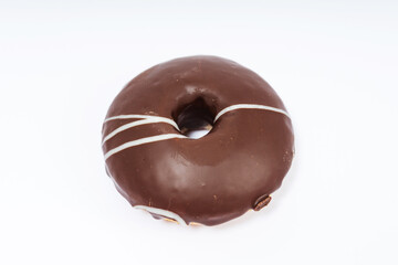 chocolate donuts on a white background. flour donuts with chocolate icing on a light background. colorful pastries