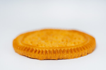 round cookies on a white background. sweet cookies without filling on a light background. high-calorie flour sweets