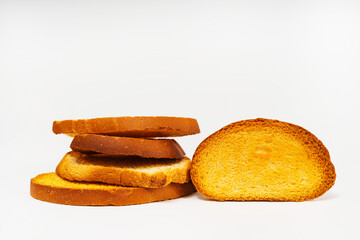 baked slices of bread on a light background. sweet white bread cooked in the oven. flour sweets on a white background