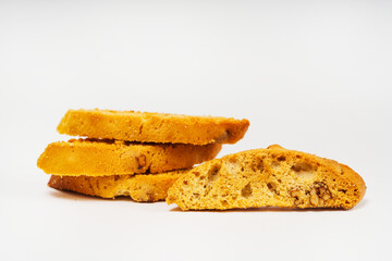 baked slices of bread with nuts on a light background. sweet white bread cooked in the oven. flour sweets on a white background