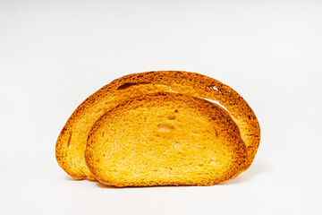 baked slices of bread on a light background. sweet white bread cooked in the oven. flour sweets on a white background