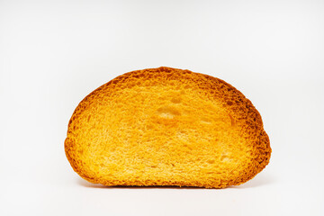 baked slices of bread on a light background. sweet white bread cooked in the oven. flour sweets on a white background