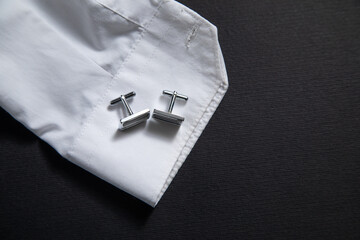 Luxury men cufflinks with a detail of shirt.