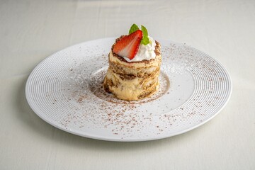 Delicious gourmet pastry-based sweet treat served on a white plate