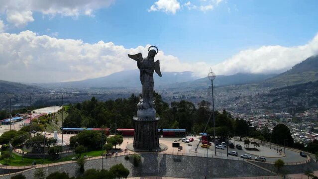 Aerial of the Panecillo statue with the cityscape of Quito in Ecuador in the background
